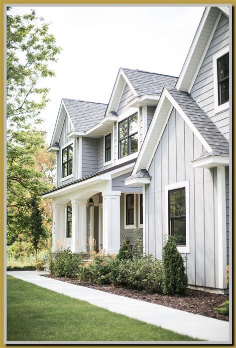 light gray house with maroon metal roof|modern grey house exterior.